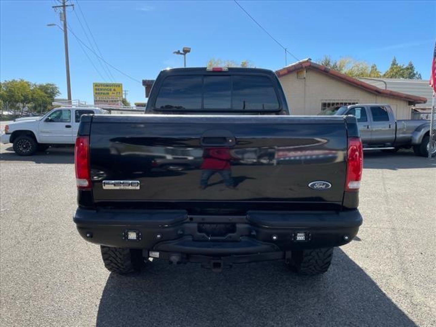 2006 Black Clearcoat Ford F-250 Super Duty Lariat (1FTSW21P46E) with an 6.0L Power Stroke 6.0L Diesel Turbo V8 325hp 560ft. lbs. Direct Injection engine, 5-Speed Automatic transmission, located at 800 Riverside Ave, Roseville, CA, 95678, 916-773-4549 & Toll Free: 866-719-4393, 38.732265, -121.291039 - DIESEL CREW CAB 4X4 LARIAT LIFTED CLEAN CARFAX - Photo#3