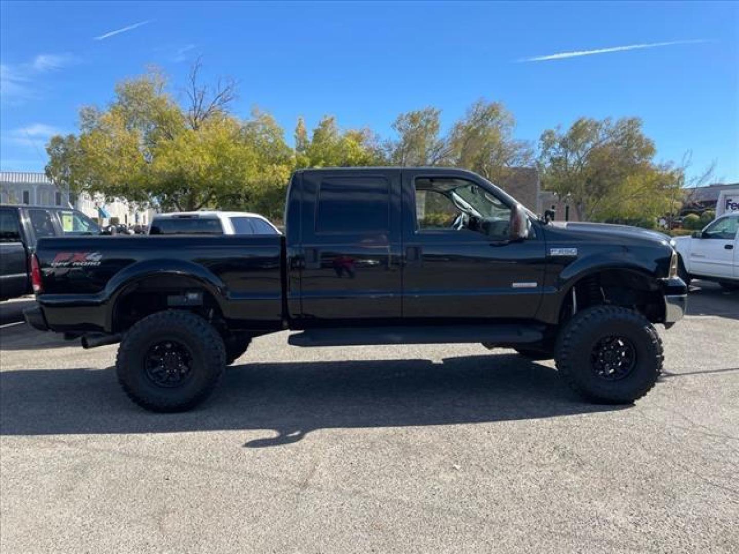 2006 Black Clearcoat Ford F-250 Super Duty Lariat (1FTSW21P46E) with an 6.0L Power Stroke 6.0L Diesel Turbo V8 325hp 560ft. lbs. Direct Injection engine, 5-Speed Automatic transmission, located at 800 Riverside Ave, Roseville, CA, 95678, 916-773-4549 & Toll Free: 866-719-4393, 38.732265, -121.291039 - DIESEL CREW CAB 4X4 LARIAT LIFTED CLEAN CARFAX - Photo#5