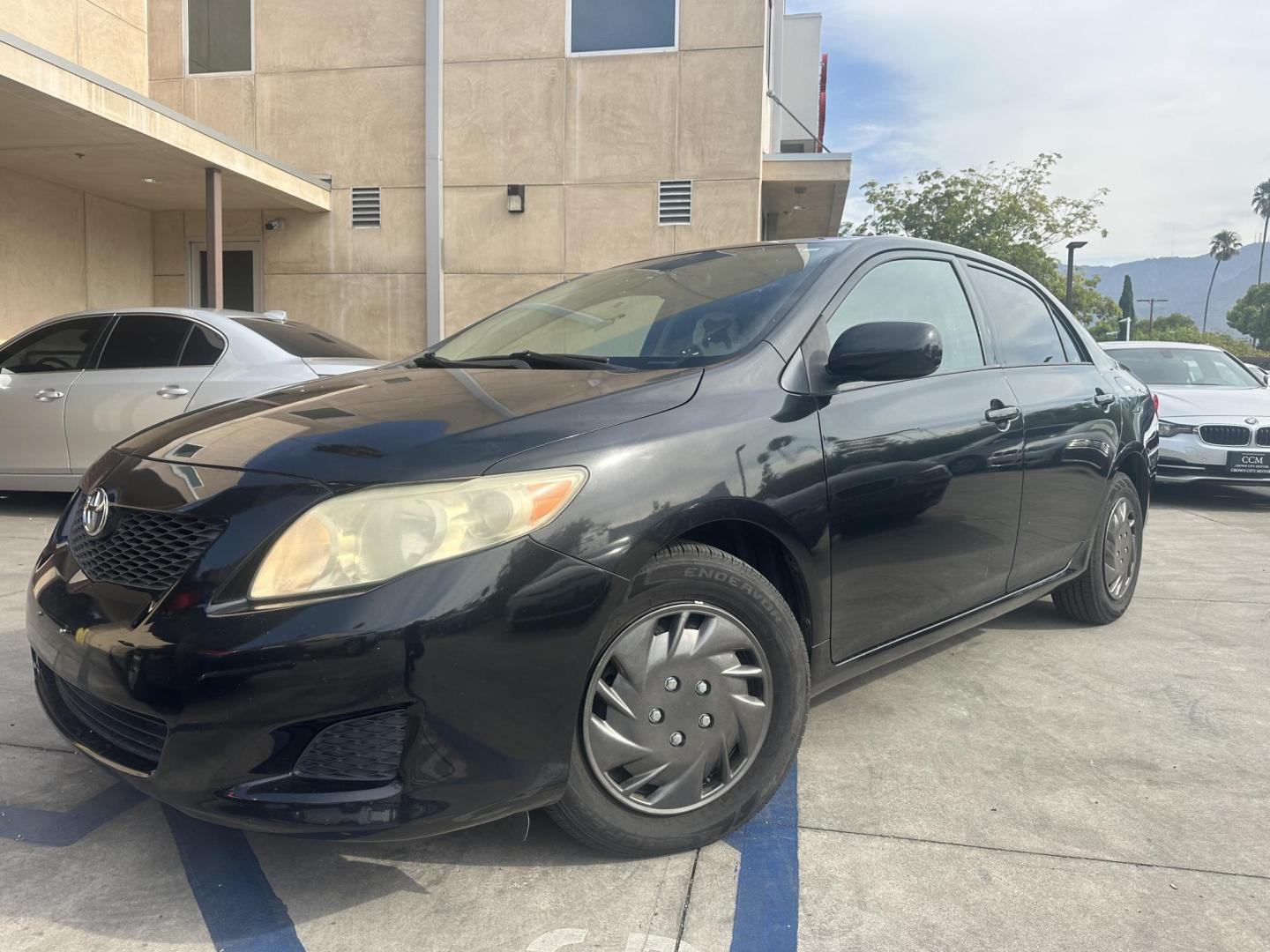 2010 Black /Gray Toyota Corolla Cloth (JTDBU4EE7A9) with an 4 Cylinder engine, Automatic transmission, located at 30 S. Berkeley Avenue, Pasadena, CA, 91107, (626) 248-7567, 34.145447, -118.109398 - MPG! This Corolla looks and drives well. - Photo#0