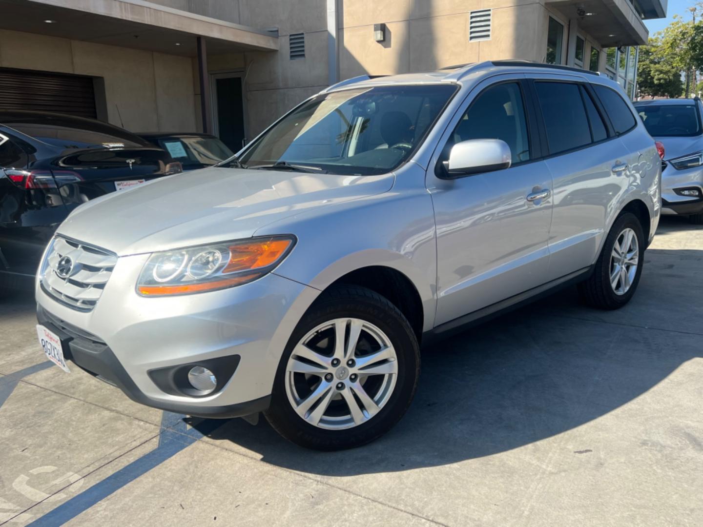 2011 Silver Hyundai Santa Fe Limited 3.5 4WD (5XYZKDAG3BG) with an 3.5L V6 DOHC 24V engine, 6-Speed Automatic transmission, located at 30 S. Berkeley Avenue, Pasadena, CA, 91107, (626) 248-7567, 34.145447, -118.109398 - Fully Loaded! Navigation, Alloys , Leather !! Crown City Motors is a used “Buy Here Pay Here” car dealer in Pasadena CA. “Buy Here Pay Here” financing, means that when you purchase your vehicle from our dealership, that you make the payments to the dealership as well. We do not need the ban - Photo#0