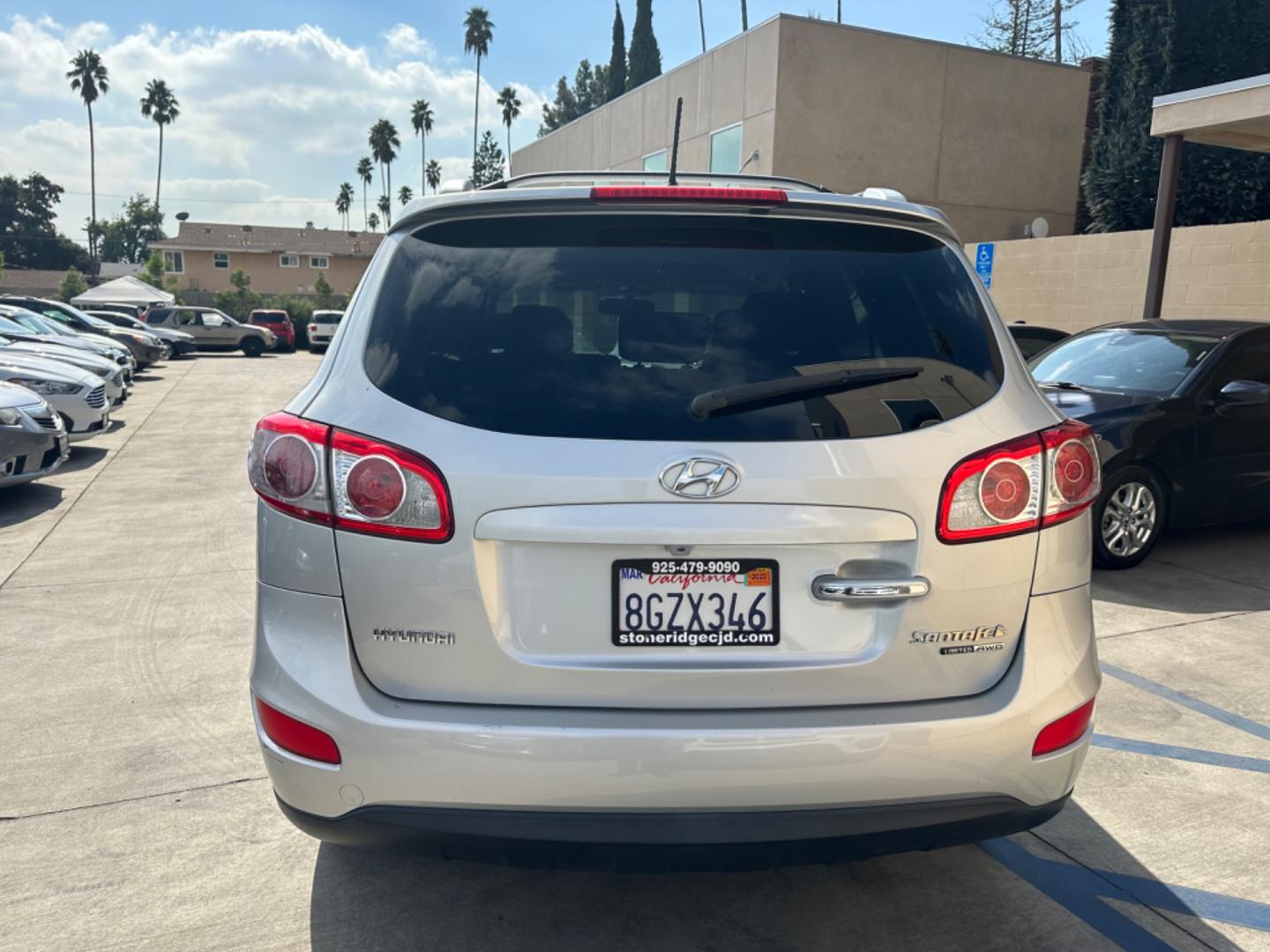 2011 Silver Hyundai Santa Fe Limited 3.5 4WD (5XYZKDAG3BG) with an 3.5L V6 DOHC 24V engine, 6-Speed Automatic transmission, located at 30 S. Berkeley Avenue, Pasadena, CA, 91107, (626) 248-7567, 34.145447, -118.109398 - Fully Loaded! Navigation, Alloys , Leather !! Crown City Motors is a used “Buy Here Pay Here” car dealer in Pasadena CA. “Buy Here Pay Here” financing, means that when you purchase your vehicle from our dealership, that you make the payments to the dealership as well. We do not need the ban - Photo#15