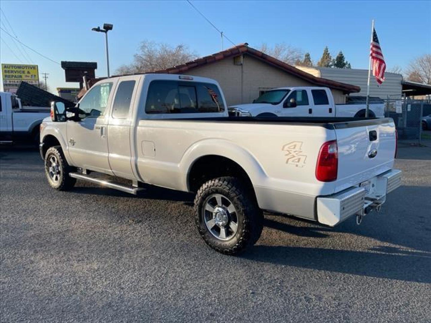 2011 Oxford White/Sterling Grey Ford F-350 Super Duty Lariat (1FT8X3BT9BE) with an 6.7L Power Stroke 6.7L Biodiesel Turbo V8 400hp 800ft. lbs. Common Rail Direct Injection engine, 6-Speed Shiftable Automatic transmission, located at 800 Riverside Ave, Roseville, CA, 95678, 916-773-4549 & Toll Free: 866-719-4393, 38.732265, -121.291039 - DIESEL SUPER CAB 4X4 LARIAT ONE OWNER SERVICE RECORDS ON CLEAN CARFAX - Photo#2