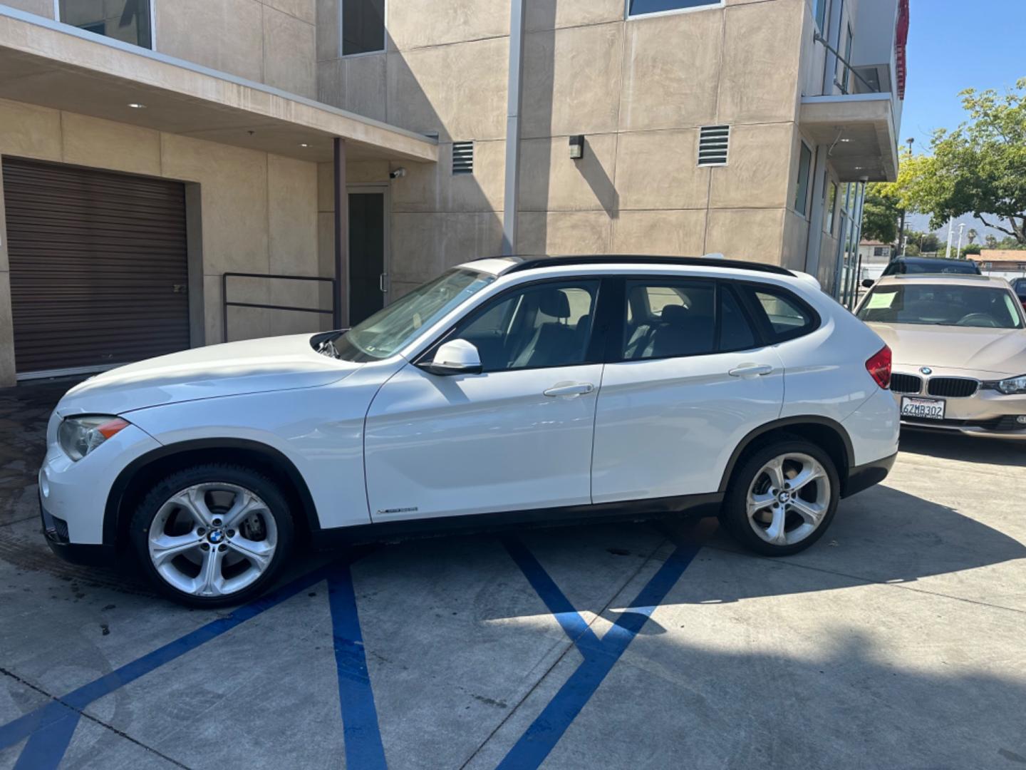 2013 WHITE /Tan BMW X1 xDrive35i (WBAVM5C54DV) with an 3.0L L6 DOHC 24V engine, 6-Speed Automatic transmission, located at 30 S. Berkeley Avenue, Pasadena, CA, 91107, (626) 248-7567, 34.145447, -118.109398 - Navigation! Panoramic-roof! Back up camera! Premium package! AWD! This 2013 BMW X1 xDrive35i looks and drives well. - Photo#1