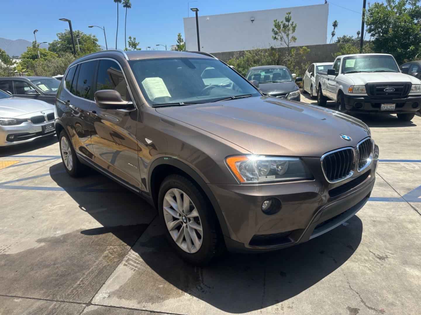 2013 Chestnut Bronze Metallic /Black BMW X3 Leather (5UXWX9C53D0) with an 2.0 engine, Automatic transmission, located at 30 S. Berkeley Avenue, Pasadena, CA, 91107, (626) 248-7567, 34.145447, -118.109398 - 2013 BMW X3 2.0 Turbo: Your Ideal Pre-Owned Luxury SUV in Pasadena, CA When searching for used BHPH cars in Pasadena, CA, the 2013 BMW X3 2.0 Turbo stands out as a premier choice. This luxury compact SUV combines performance, style, and comfort, making it a highly sought-after vehicle in the pre-ow - Photo#7