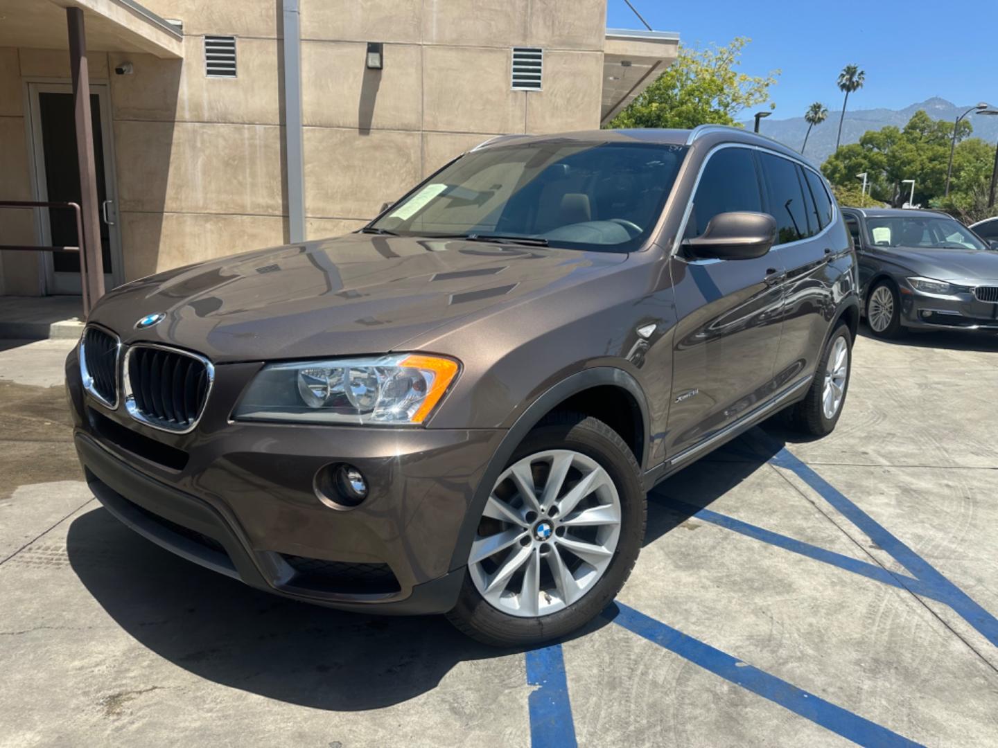 2013 Chestnut Bronze Metallic /Black BMW X3 Leather (5UXWX9C53D0) with an 2.0 engine, Automatic transmission, located at 30 S. Berkeley Avenue, Pasadena, CA, 91107, (626) 248-7567, 34.145447, -118.109398 - 2013 BMW X3 2.0 Turbo: Your Ideal Pre-Owned Luxury SUV in Pasadena, CA When searching for used BHPH cars in Pasadena, CA, the 2013 BMW X3 2.0 Turbo stands out as a premier choice. This luxury compact SUV combines performance, style, and comfort, making it a highly sought-after vehicle in the pre-ow - Photo#30