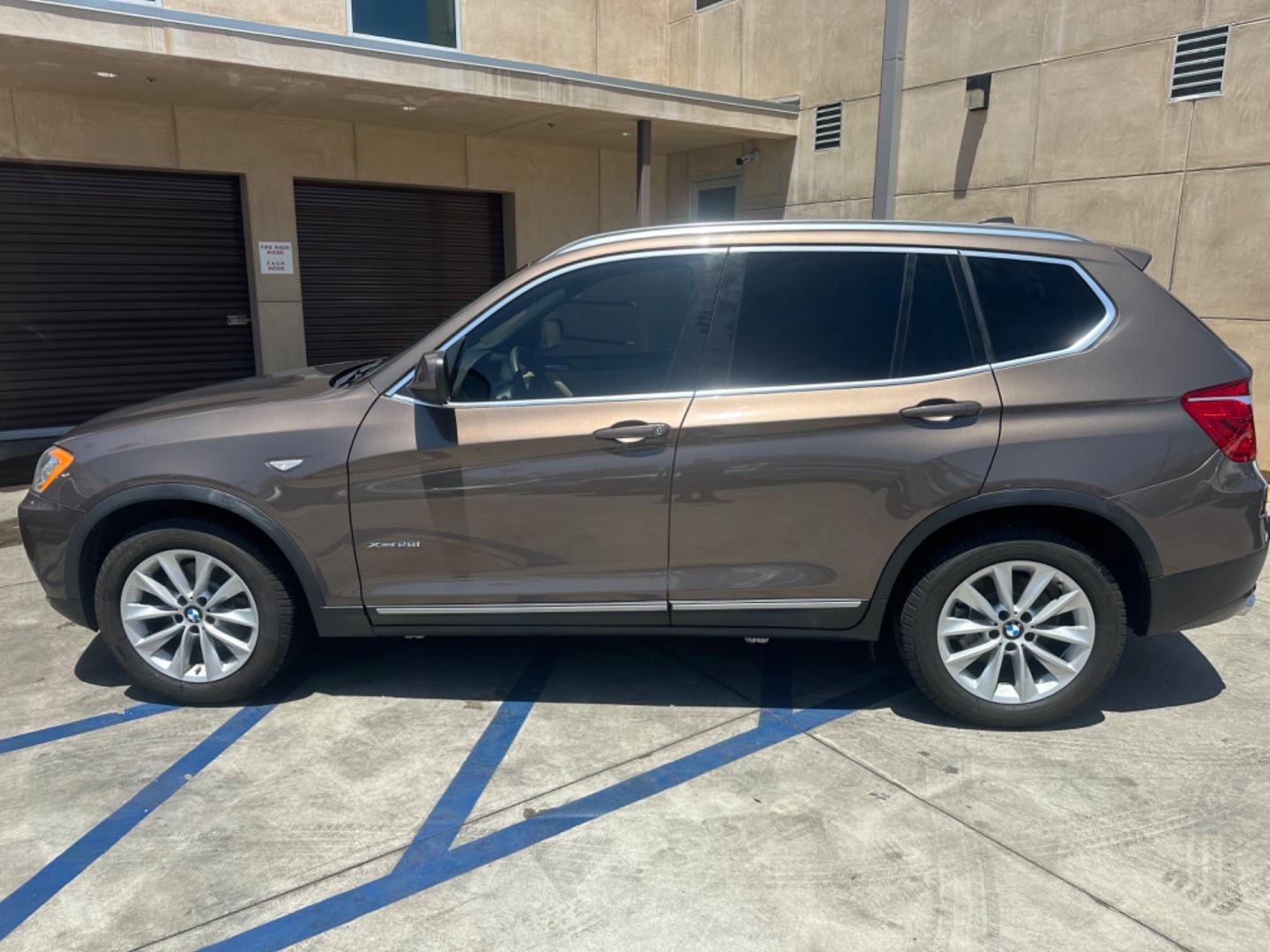 2013 Chestnut Bronze Metallic /Black BMW X3 Leather (5UXWX9C53D0) with an 2.0 engine, Automatic transmission, located at 30 S. Berkeley Avenue, Pasadena, CA, 91107, (626) 248-7567, 34.145447, -118.109398 - 2013 BMW X3 2.0 Turbo: Your Ideal Pre-Owned Luxury SUV in Pasadena, CA When searching for used BHPH cars in Pasadena, CA, the 2013 BMW X3 2.0 Turbo stands out as a premier choice. This luxury compact SUV combines performance, style, and comfort, making it a highly sought-after vehicle in the pre-ow - Photo#2