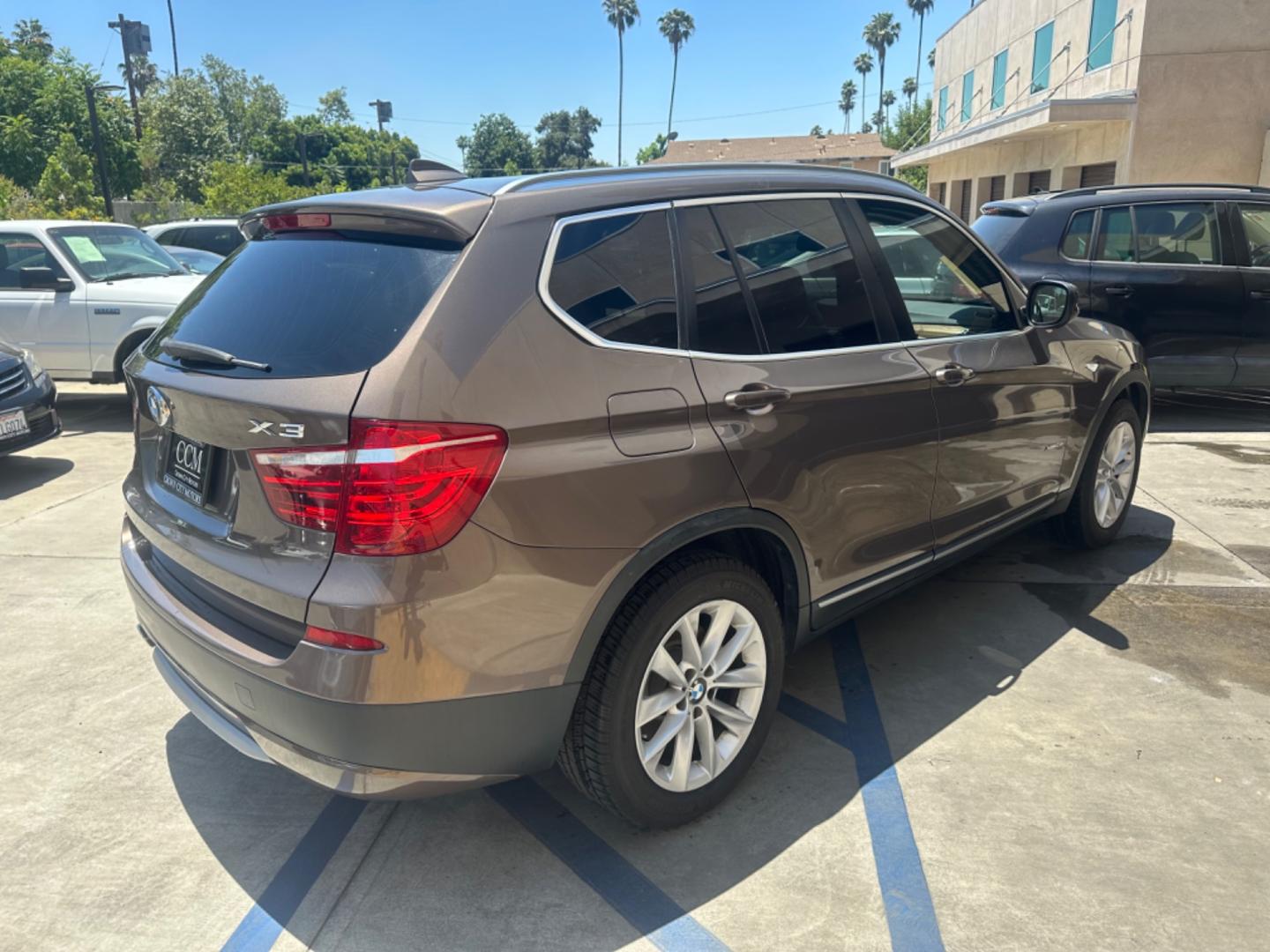 2013 Chestnut Bronze Metallic /Black BMW X3 Leather (5UXWX9C53D0) with an 2.0 engine, Automatic transmission, located at 30 S. Berkeley Avenue, Pasadena, CA, 91107, (626) 248-7567, 34.145447, -118.109398 - 2013 BMW X3 2.0 Turbo: Your Ideal Pre-Owned Luxury SUV in Pasadena, CA When searching for used BHPH cars in Pasadena, CA, the 2013 BMW X3 2.0 Turbo stands out as a premier choice. This luxury compact SUV combines performance, style, and comfort, making it a highly sought-after vehicle in the pre-ow - Photo#5