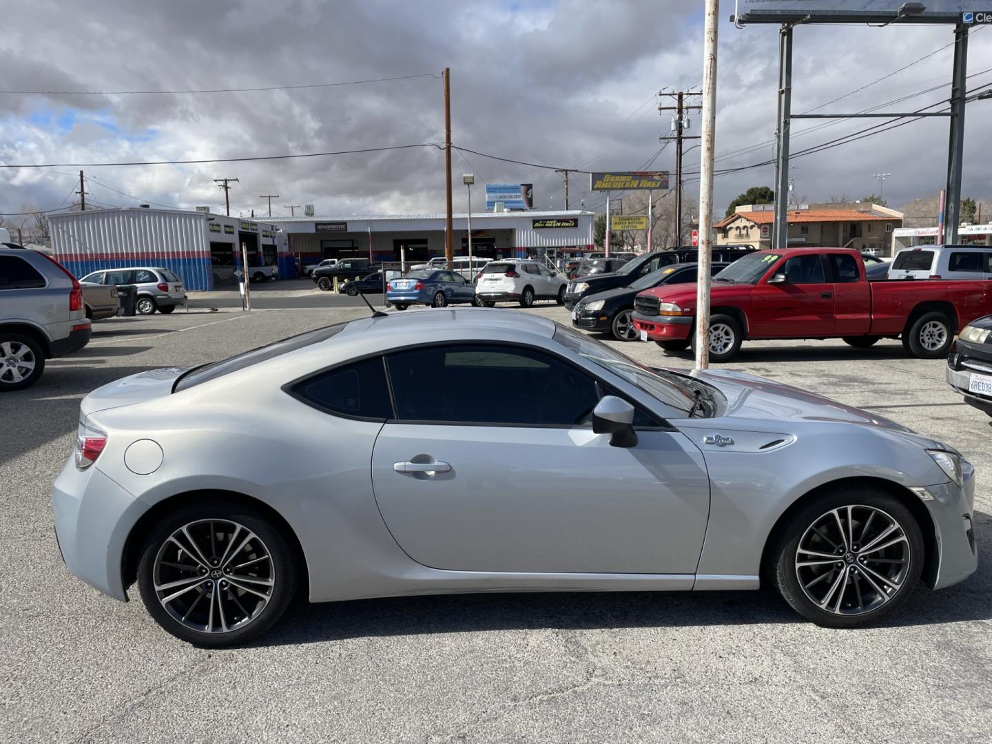 2013 Scion FR-S 6AT (JF1ZNAA15D2) with an 2.0L H4 16V engine, 6-Speed Automatic transmission, located at 44356 Date Ave., Lancaster, CA, 93534, (661) 945-6555, 34.688919, -118.139374 - Photo#2