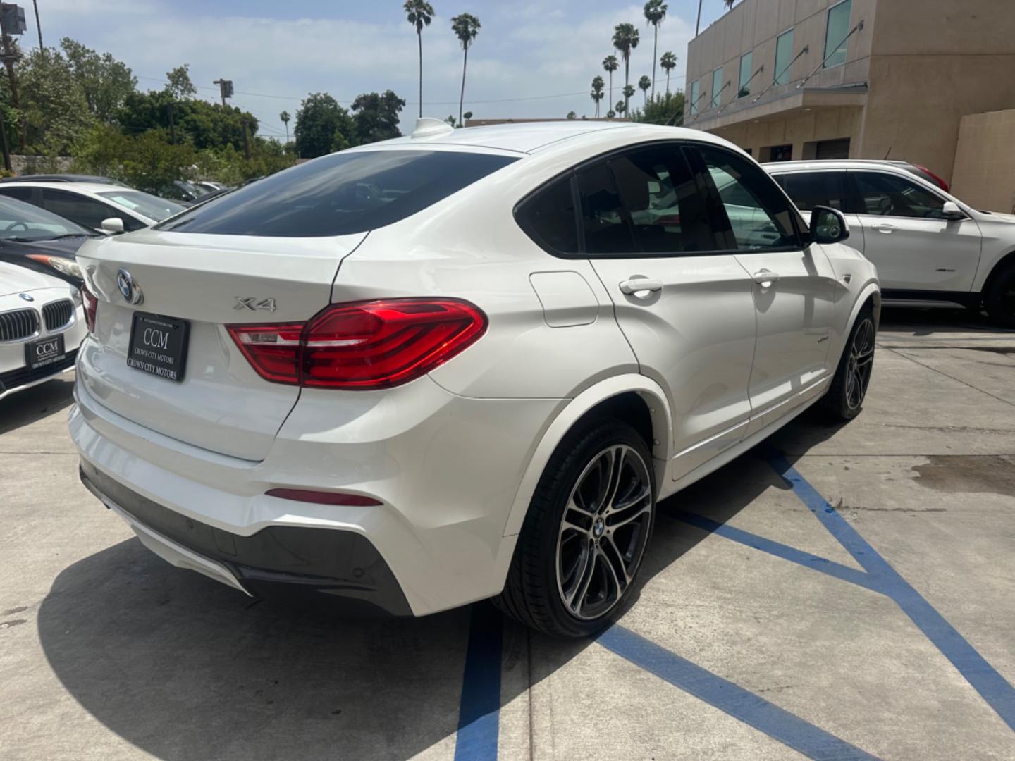 2015 Alpine White /Black BMW X4 Leather (5UXXW3C59F0) with an 2.0 engine, Automatic transmission, located at 30 S. Berkeley Avenue, Pasadena, CA, 91107, (626) 248-7567, 34.145447, -118.109398 - Discover the 2015 BMW X4 xDrive28i: Luxury Meets Affordability Are you in the market for a luxury vehicle that doesn't break the bank? Look no further than the 2015 BMW X4 xDrive28i. This impressive model offers the perfect blend of performance, style, and affordability. At our dealership, we under - Photo#5