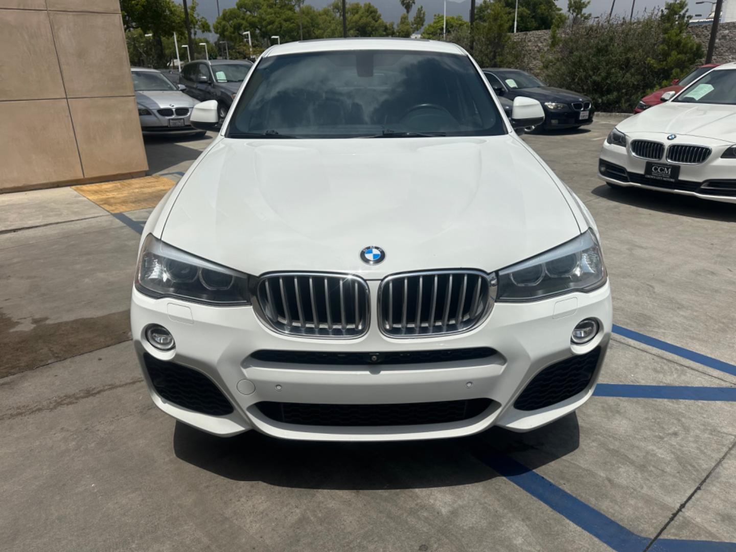 2015 Alpine White /Black BMW X4 Leather (5UXXW3C59F0) with an 2.0 engine, Automatic transmission, located at 30 S. Berkeley Avenue, Pasadena, CA, 91107, (626) 248-7567, 34.145447, -118.109398 - Discover the 2015 BMW X4 xDrive28i: Luxury Meets Affordability Are you in the market for a luxury vehicle that doesn't break the bank? Look no further than the 2015 BMW X4 xDrive28i. This impressive model offers the perfect blend of performance, style, and affordability. At our dealership, we under - Photo#8