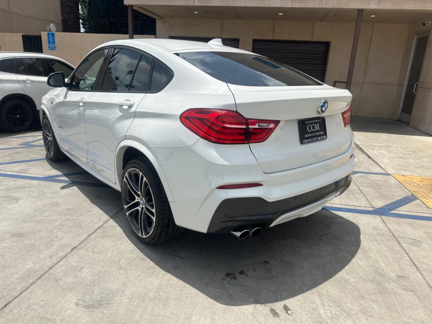 2015 Alpine White /Black BMW X4 Leather (5UXXW3C59F0) with an 2.0 engine, Automatic transmission, located at 30 S. Berkeley Avenue, Pasadena, CA, 91107, (626) 248-7567, 34.145447, -118.109398 - Discover the 2015 BMW X4 xDrive28i: Luxury Meets Affordability Are you in the market for a luxury vehicle that doesn't break the bank? Look no further than the 2015 BMW X4 xDrive28i. This impressive model offers the perfect blend of performance, style, and affordability. At our dealership, we under - Photo#3