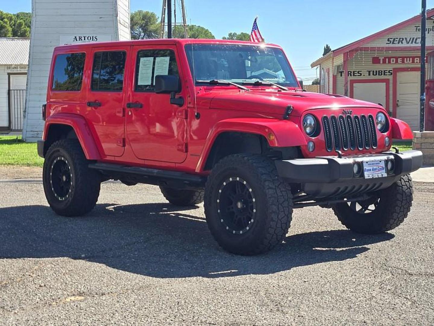 2015 RED Jeep Wrangler Unlimited (1C4BJWEG3FL) with an V6 3.6 Liter engine, Automatic 5-Spd transmission, located at 246 E Walker St., Orland, 95963, (530) 865-5800, 39.747589, -122.178398 - Photo#0