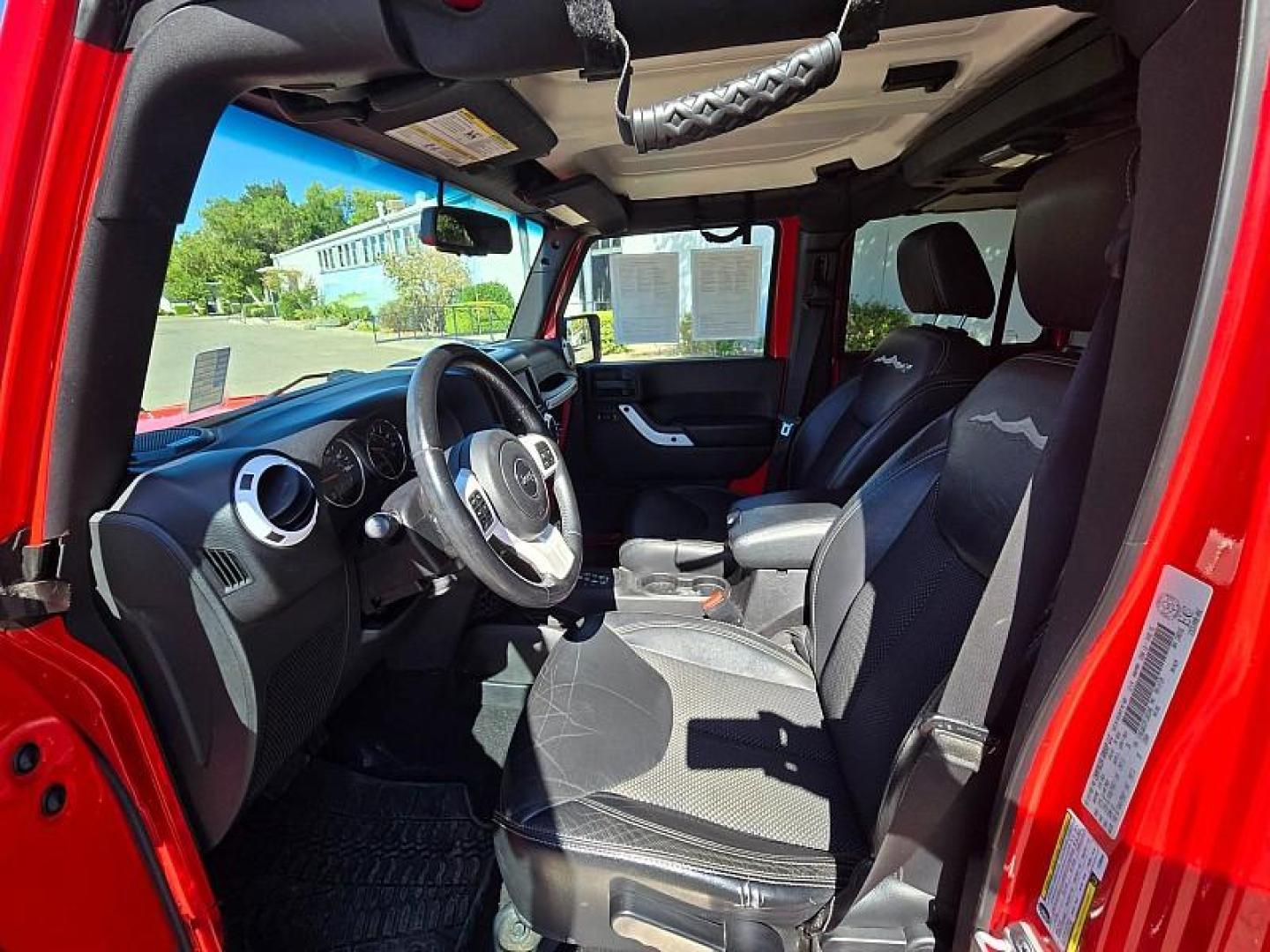 2015 RED Jeep Wrangler Unlimited (1C4BJWEG3FL) with an V6 3.6 Liter engine, Automatic 5-Spd transmission, located at 246 E Walker St., Orland, 95963, (530) 865-5800, 39.747589, -122.178398 - Photo#9