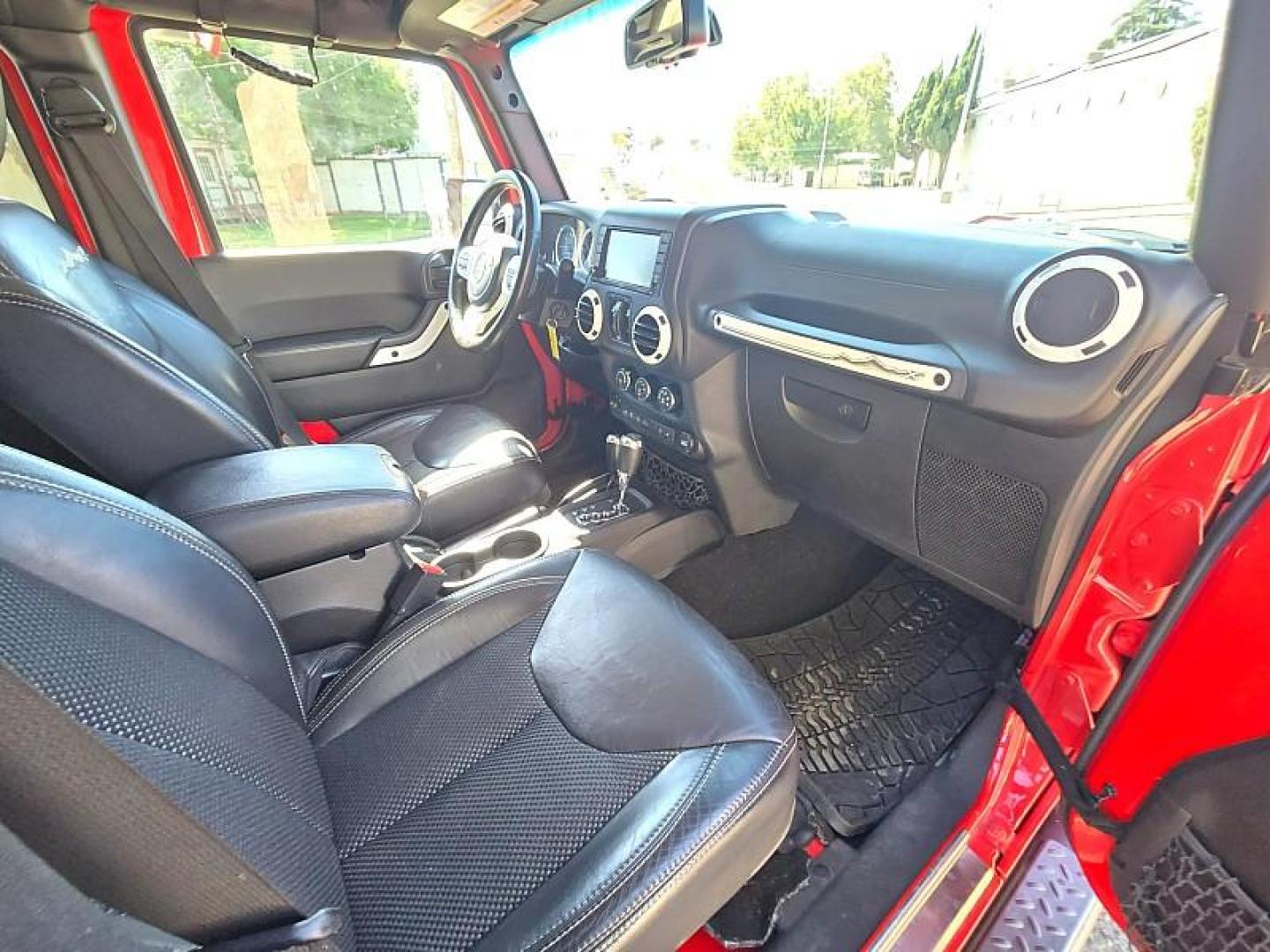 2015 RED Jeep Wrangler Unlimited (1C4BJWEG3FL) with an V6 3.6 Liter engine, Automatic 5-Spd transmission, located at 246 E Walker St., Orland, 95963, (530) 865-5800, 39.747589, -122.178398 - Photo#15