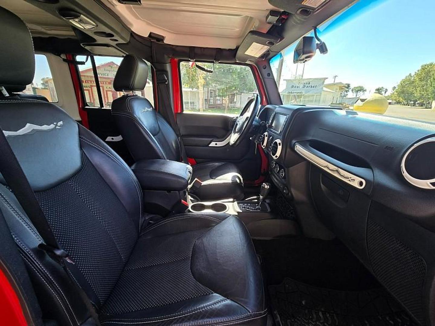 2015 RED Jeep Wrangler Unlimited (1C4BJWEG3FL) with an V6 3.6 Liter engine, Automatic 5-Spd transmission, located at 246 E Walker St., Orland, 95963, (530) 865-5800, 39.747589, -122.178398 - Photo#16