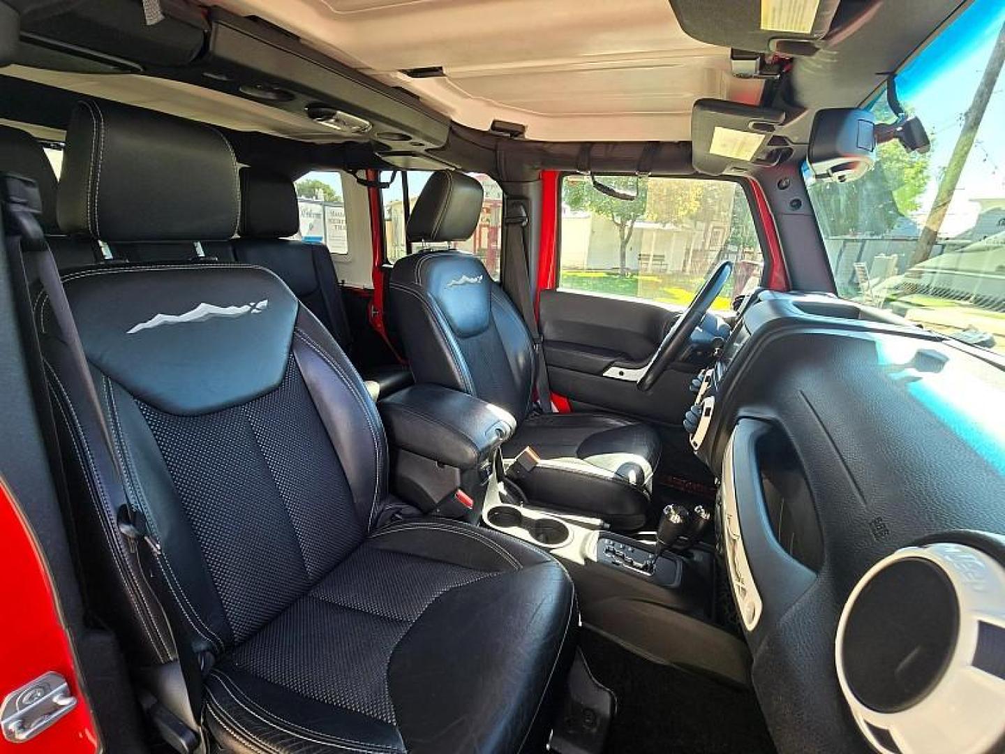 2015 RED Jeep Wrangler Unlimited (1C4BJWEG3FL) with an V6 3.6 Liter engine, Automatic 5-Spd transmission, located at 246 E Walker St., Orland, 95963, (530) 865-5800, 39.747589, -122.178398 - Photo#17