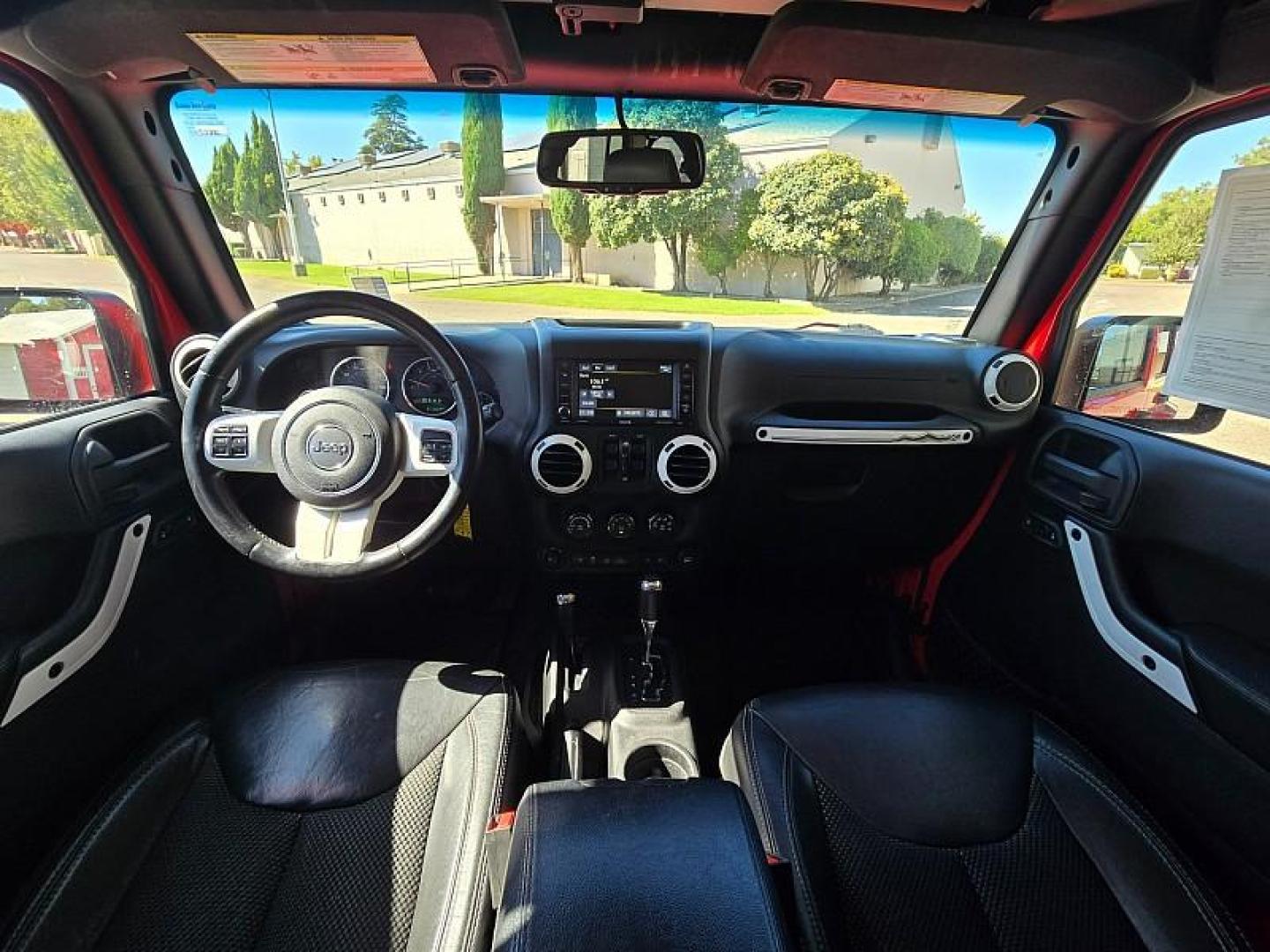 2015 RED Jeep Wrangler Unlimited (1C4BJWEG3FL) with an V6 3.6 Liter engine, Automatic 5-Spd transmission, located at 246 E Walker St., Orland, 95963, (530) 865-5800, 39.747589, -122.178398 - Photo#18