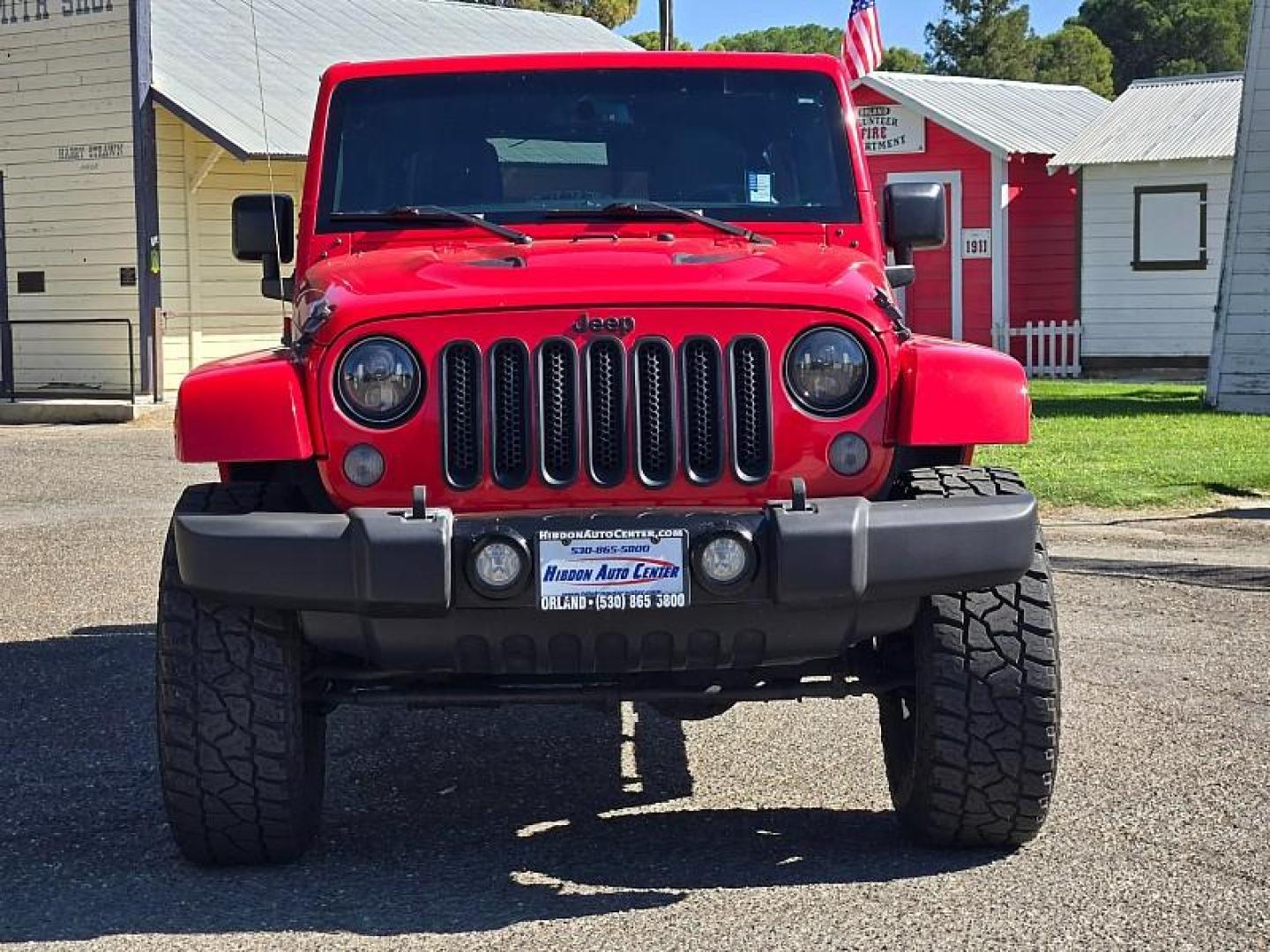 2015 RED Jeep Wrangler Unlimited (1C4BJWEG3FL) with an V6 3.6 Liter engine, Automatic 5-Spd transmission, located at 246 E Walker St., Orland, 95963, (530) 865-5800, 39.747589, -122.178398 - Photo#1