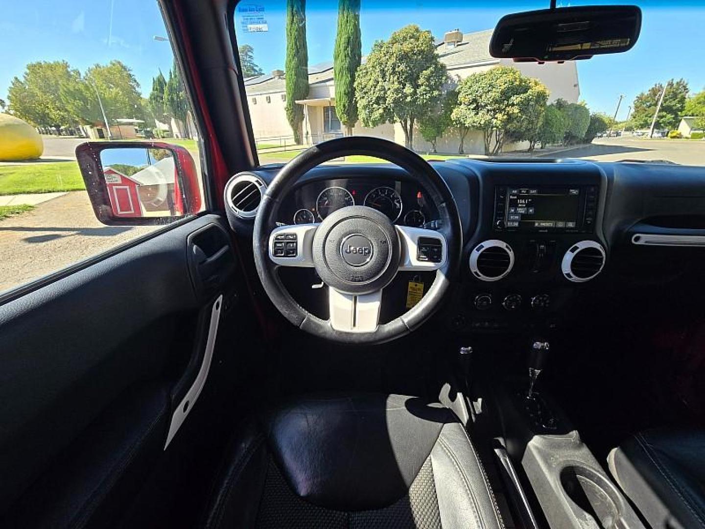 2015 RED Jeep Wrangler Unlimited (1C4BJWEG3FL) with an V6 3.6 Liter engine, Automatic 5-Spd transmission, located at 246 E Walker St., Orland, 95963, (530) 865-5800, 39.747589, -122.178398 - Photo#19