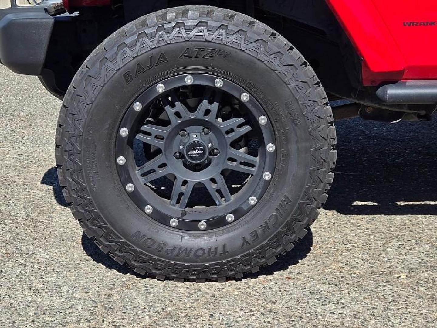 2015 RED Jeep Wrangler Unlimited (1C4BJWEG3FL) with an V6 3.6 Liter engine, Automatic 5-Spd transmission, located at 246 E Walker St., Orland, 95963, (530) 865-5800, 39.747589, -122.178398 - Photo#26