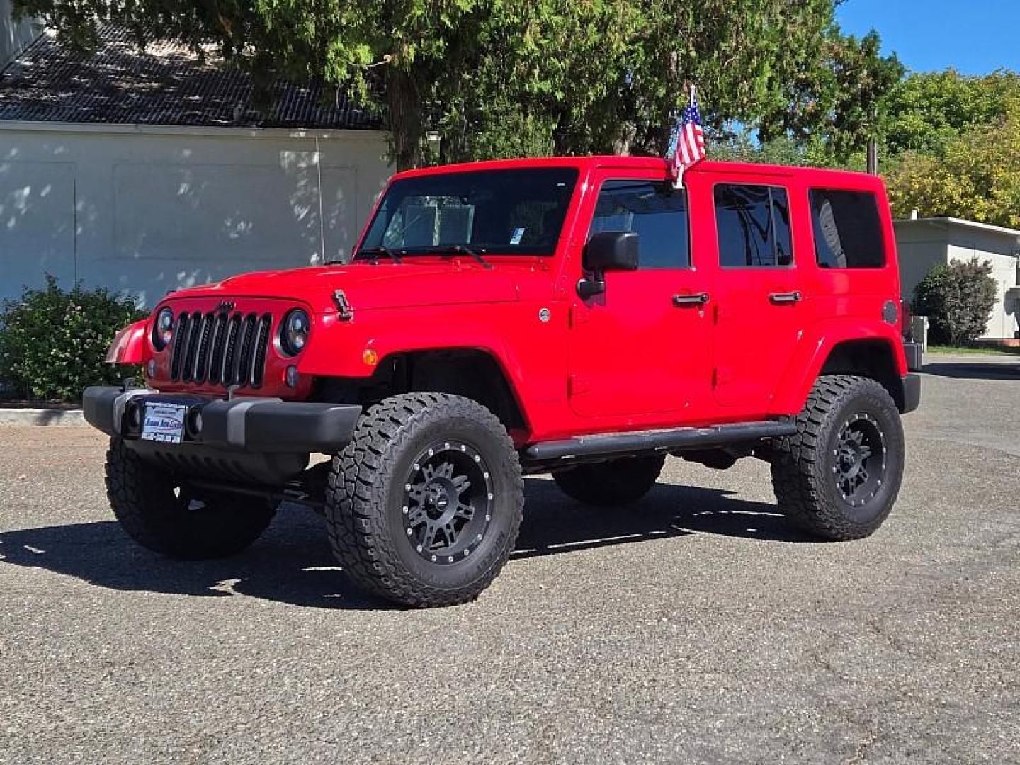 2015 RED Jeep Wrangler Unlimited (1C4BJWEG3FL) with an V6 3.6 Liter engine, Automatic 5-Spd transmission, located at 246 E Walker St., Orland, 95963, (530) 865-5800, 39.747589, -122.178398 - Photo#2