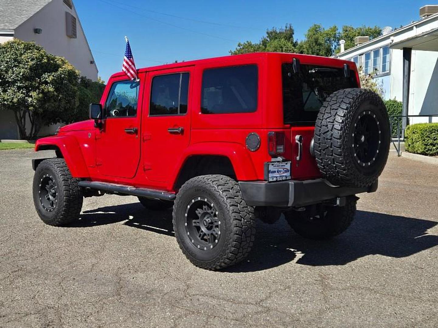 2015 RED Jeep Wrangler Unlimited (1C4BJWEG3FL) with an V6 3.6 Liter engine, Automatic 5-Spd transmission, located at 246 E Walker St., Orland, 95963, (530) 865-5800, 39.747589, -122.178398 - Photo#4