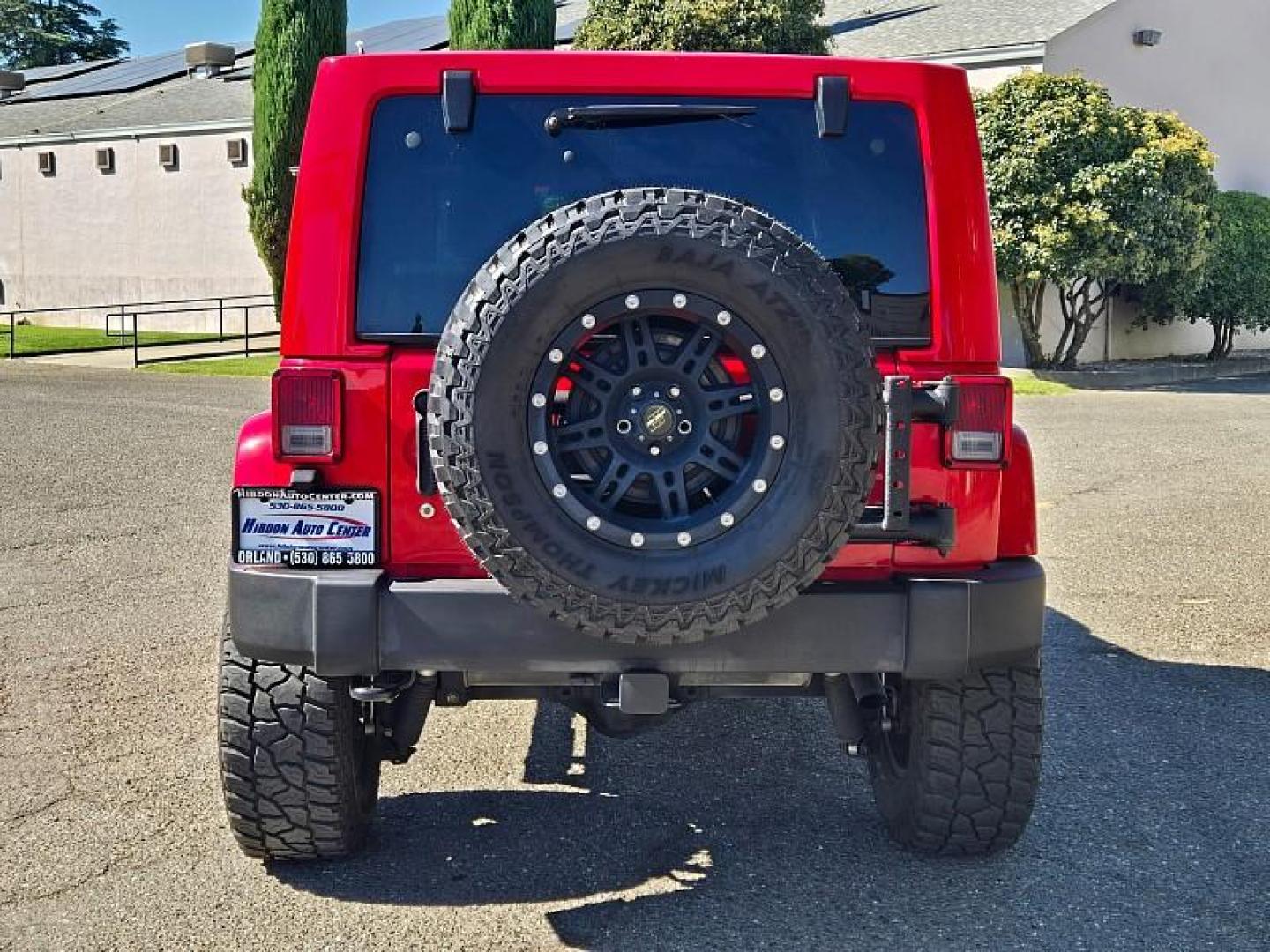 2015 RED Jeep Wrangler Unlimited (1C4BJWEG3FL) with an V6 3.6 Liter engine, Automatic 5-Spd transmission, located at 246 E Walker St., Orland, 95963, (530) 865-5800, 39.747589, -122.178398 - Photo#5