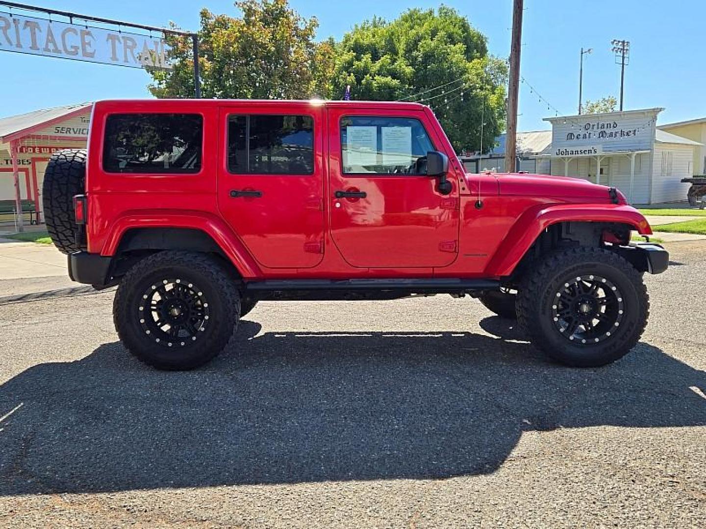 2015 RED Jeep Wrangler Unlimited (1C4BJWEG3FL) with an V6 3.6 Liter engine, Automatic 5-Spd transmission, located at 246 E Walker St., Orland, 95963, (530) 865-5800, 39.747589, -122.178398 - Photo#7