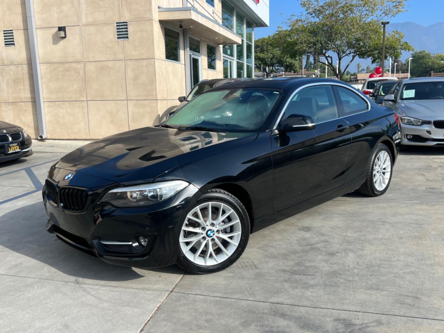 2016 Black BMW 2-Series 228i SULEV Coupe (WBA1F9C51GV) with an 2.0L L4 DOHC 16V engine, 8A transmission, located at 30 S. Berkeley Avenue, Pasadena, CA, 91107, (626) 248-7567, 34.145447, -118.109398 - Crown City Motors is a used “Buy Here Pay Here” car dealer in Pasadena CA. “Buy Here Pay Here” financing, means that when you purchase your vehicle from our dealership, that you make the payments to the dealership as well. We do not need the banks approval to get you approved for a used auto - Photo#1