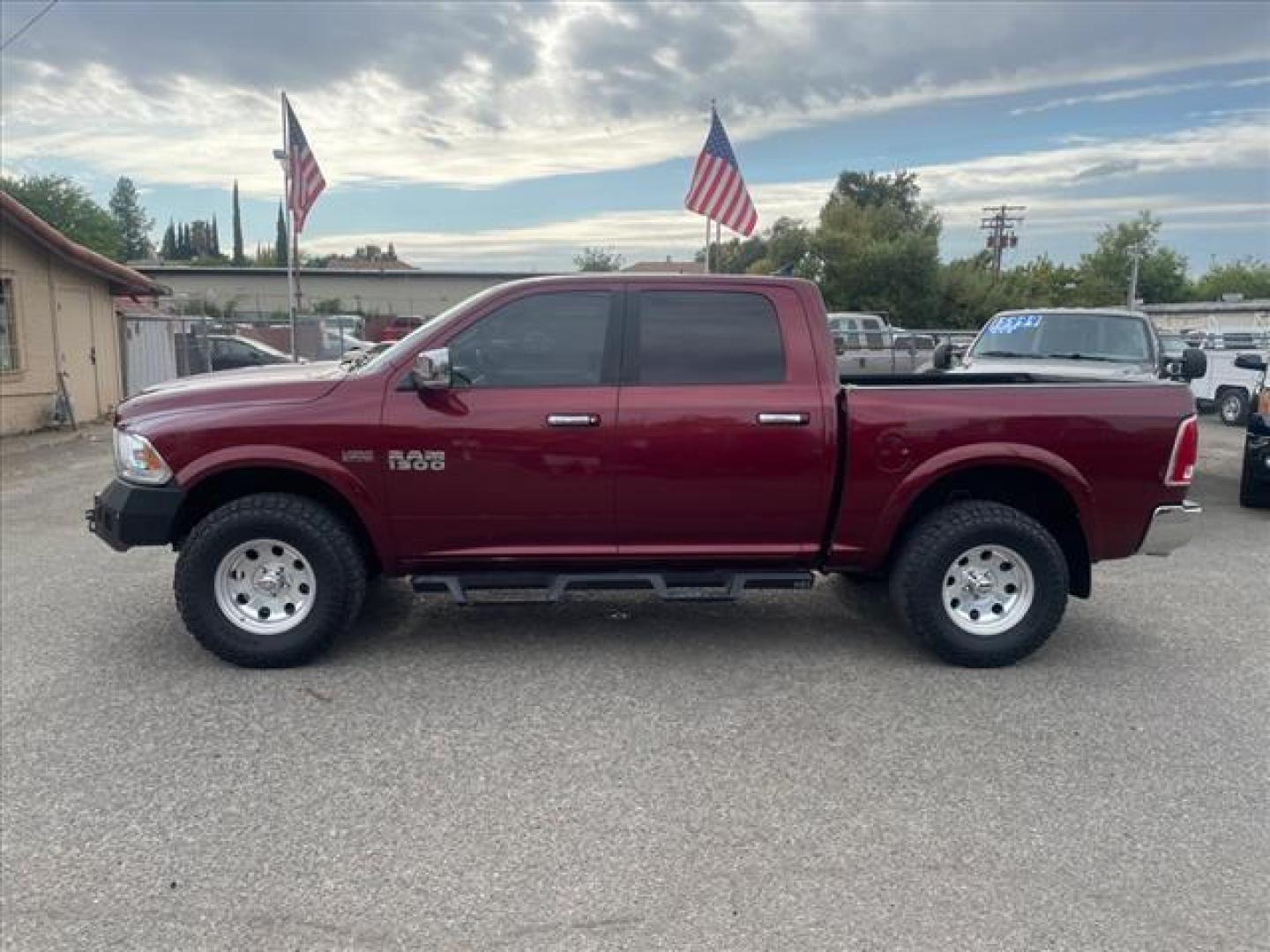 2017 Delmonico Red Pearl Coat RAM 1500 Laramie (1C6RR7NT6HS) with an 5.7L HEMI 5.7L V8 395hp 410ft. lbs. Sequential Multiport Fuel Injection engine, 8-Speed Shiftable Automatic transmission, located at 800 Riverside Ave, Roseville, CA, 95678, 916-773-4549 & Toll Free: 866-719-4393, 38.732265, -121.291039 - 4X4 CREW CAB LARAMIE 5.7 HEMI V8 CLEAN CARFAX - Photo#1