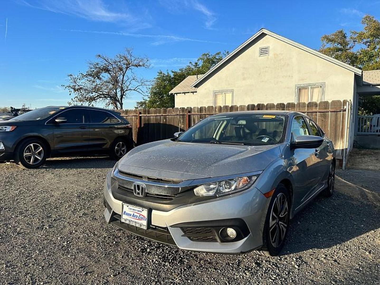 2018 SILVER Honda Civic Sedan (JHMFC1F74JX) with an 4-Cyl Turbo 1.5 Liter engine, Automatic CVT transmission, located at 246 E Walker St., Orland, 95963, (530) 865-5800, 39.747589, -122.178398 - Photo#0